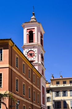Historic clock tower against a clear blue sky in Nice, capturing the charm of Provence-Alpes-Côte d'Azur.