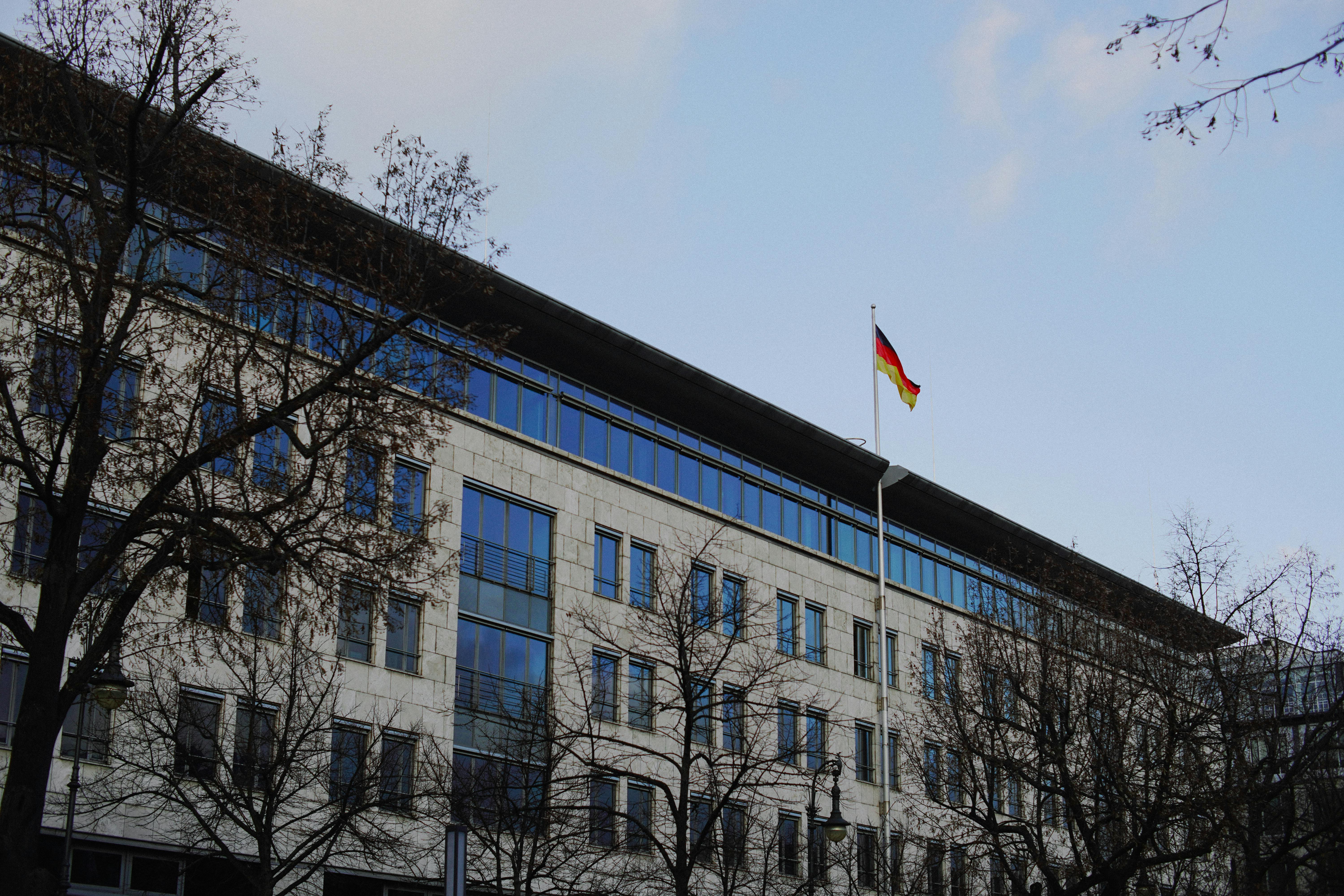 modern building with german flag in winter