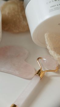 A calming and elegant flat lay of skincare tools and products, perfect for beauty and wellness themes.