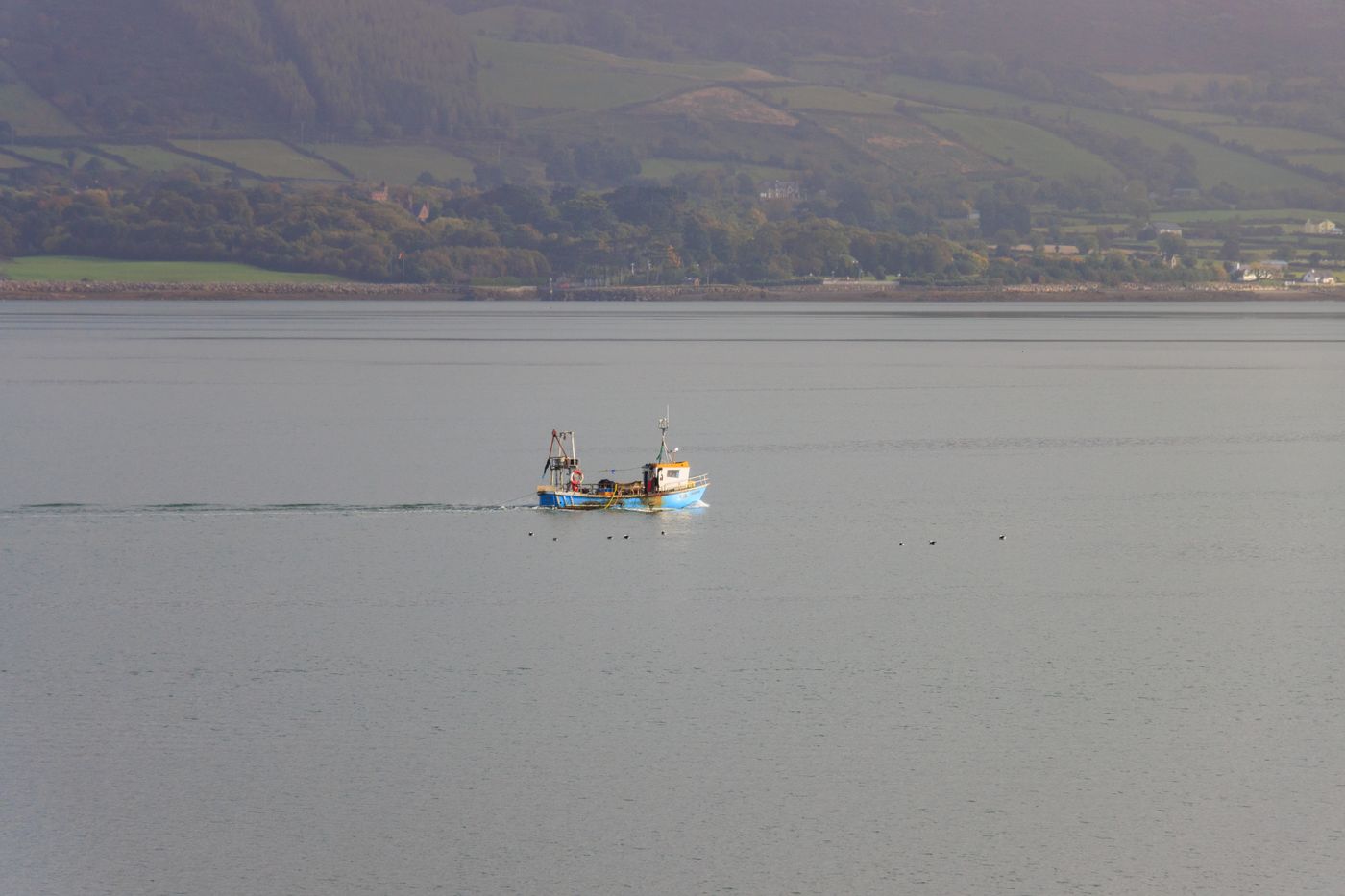 Fishing boat on the calm waters of an Irish lough
