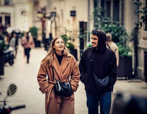Free A young couple enjoying a walk in Marseille, capturing a candid moment of joy and connection. Stock Photo