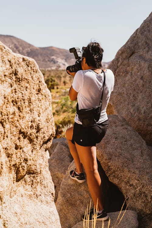 Person Standing on Rock