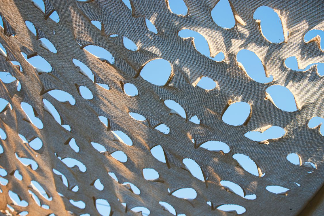 Patterned Canopy Patterned fabric canopy under clear sky ยท Free Stock Photo
