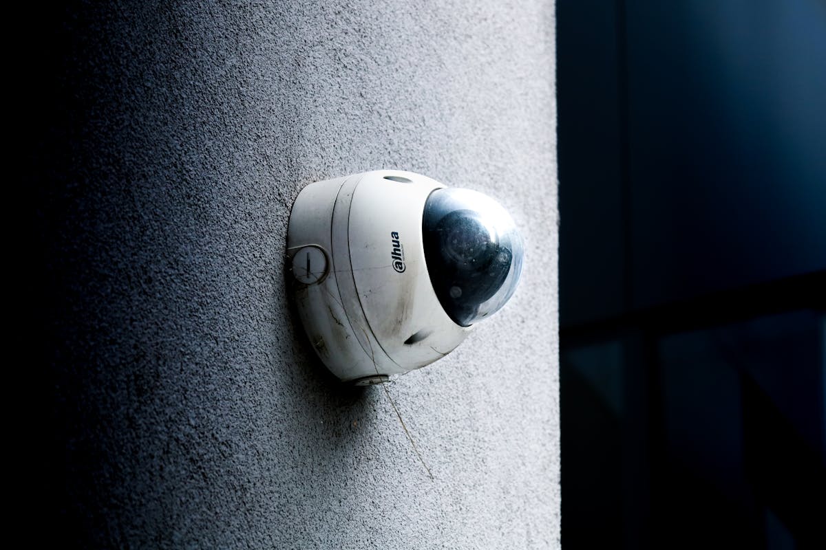 Modern AI security camera with facial recognition technology mounted at proper height