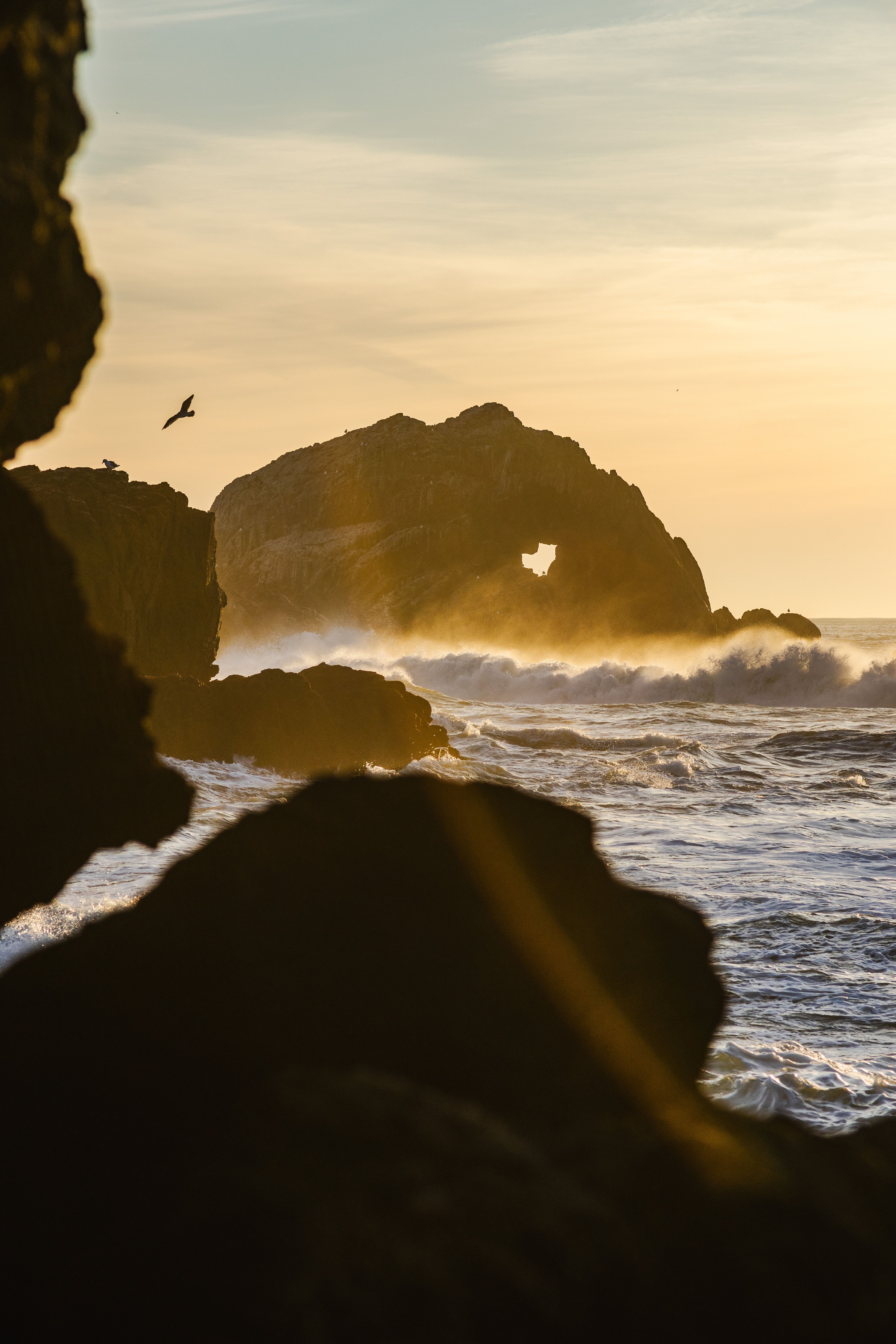 Golden Hour Ocean Waves at Rocky Shore · Free Stock Photo