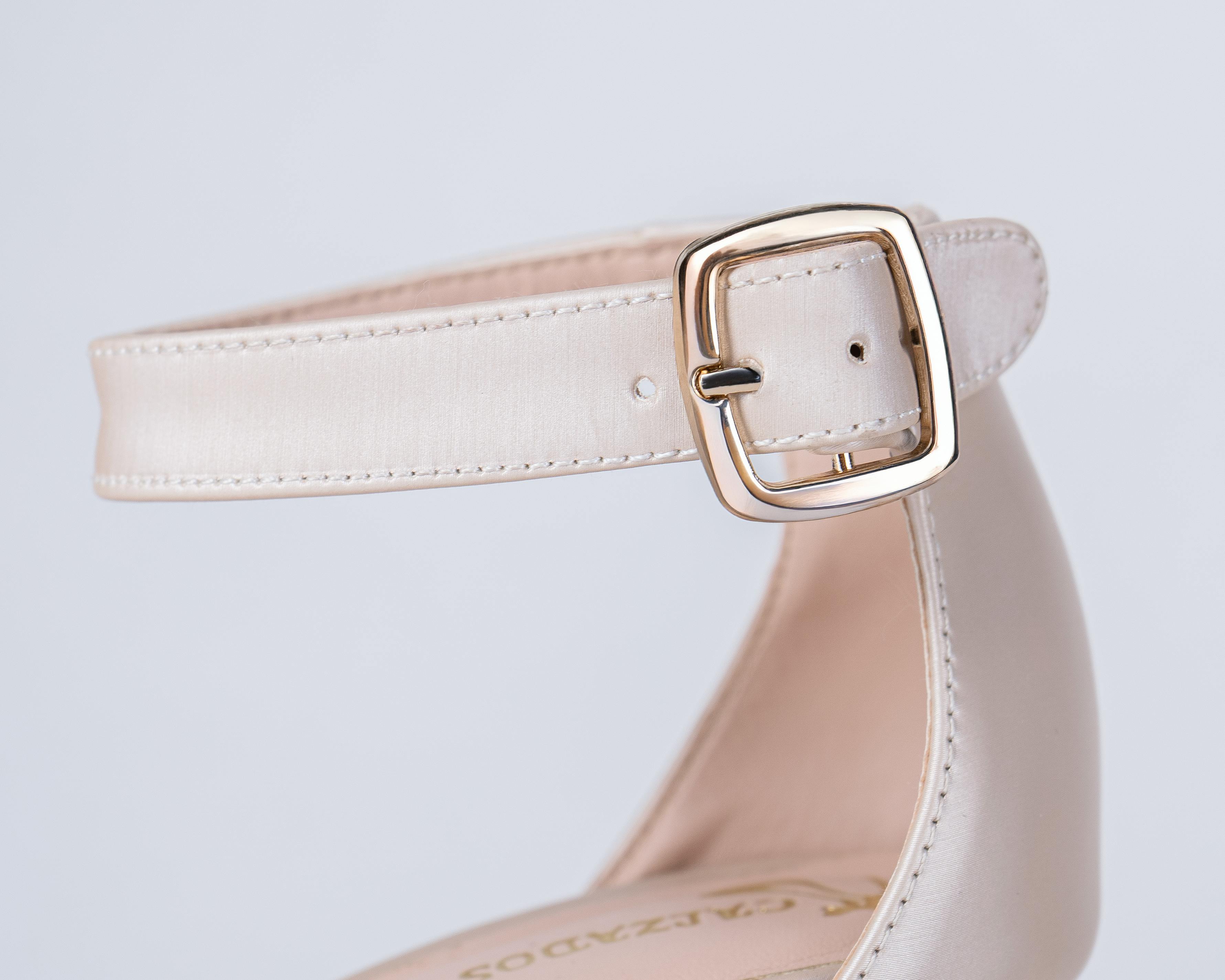 close up of elegant beige shoe buckle