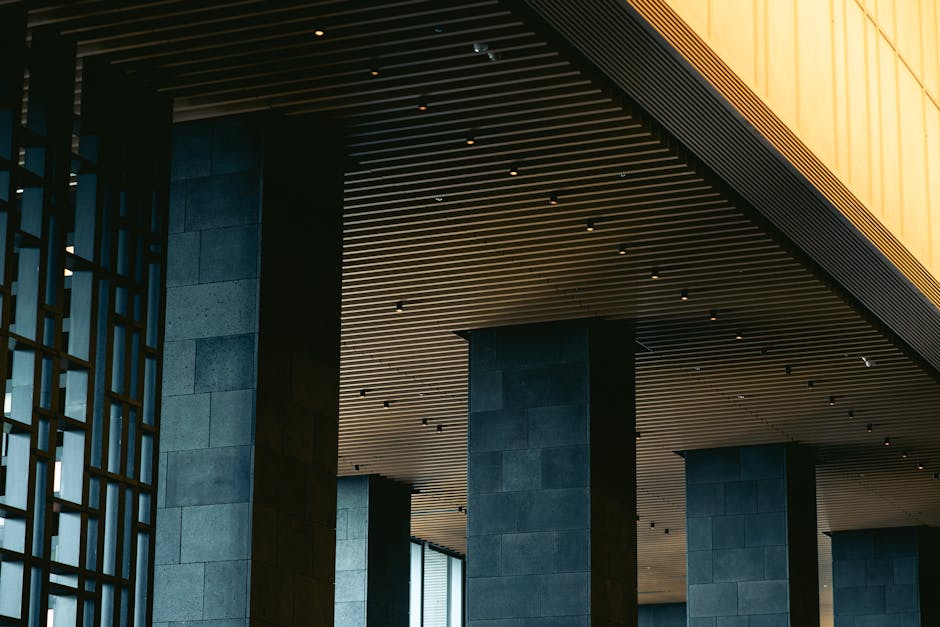 Modern exhibition booth in luxury hotel lobby with hospitality industry professionals networking