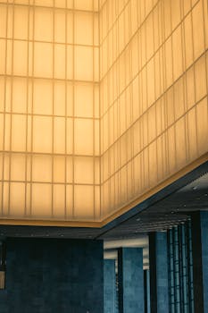 Elegant modern hotel lobby interior in Tokyo with a luxurious lighting design creating a warm ambiance.
