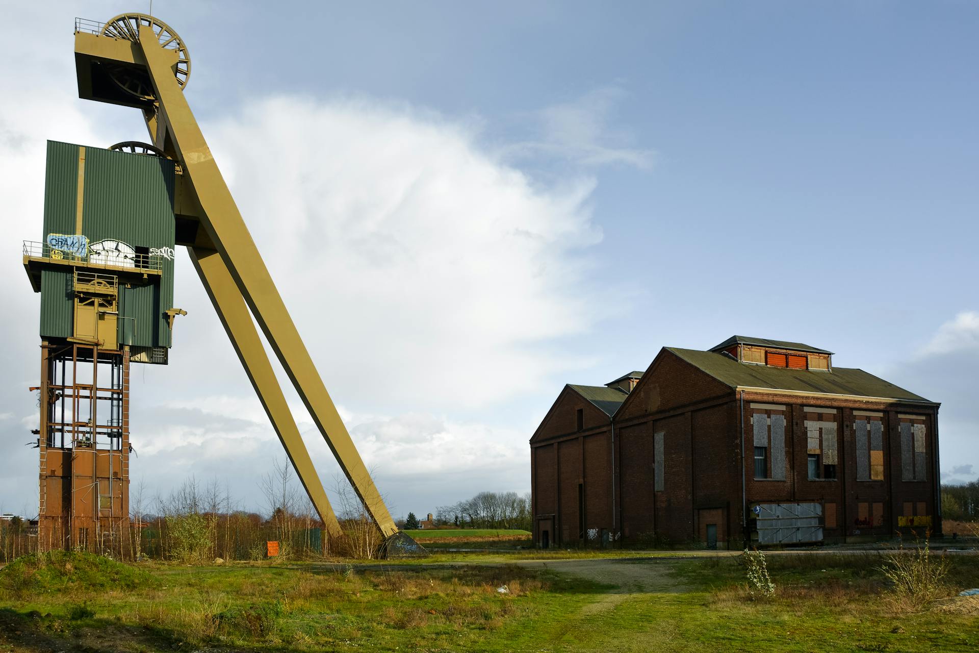 Old mining structure and building in Velbert, Germany under clear skies.