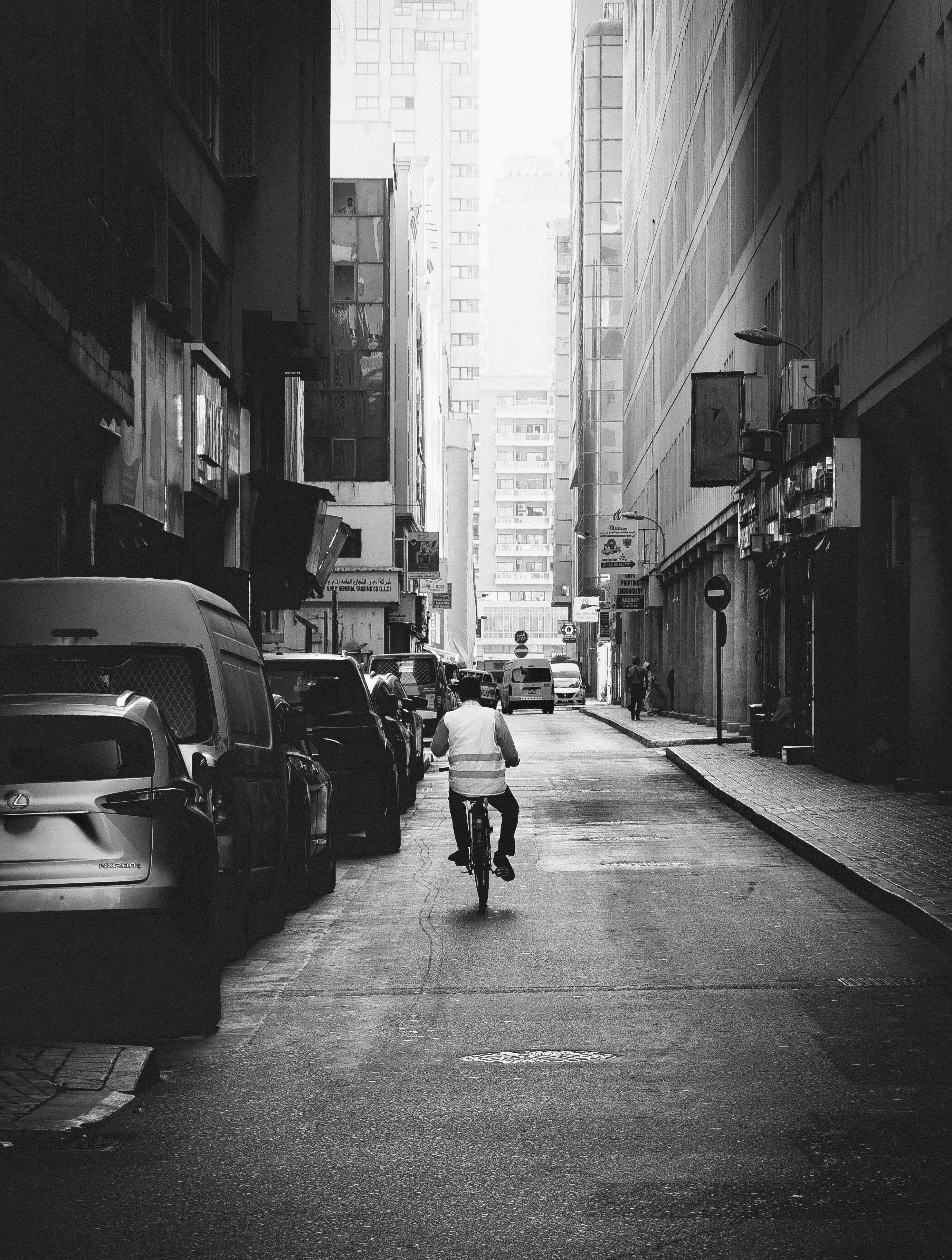 Black and White Urban Street Scene with Cyclist · Free Stock Photo