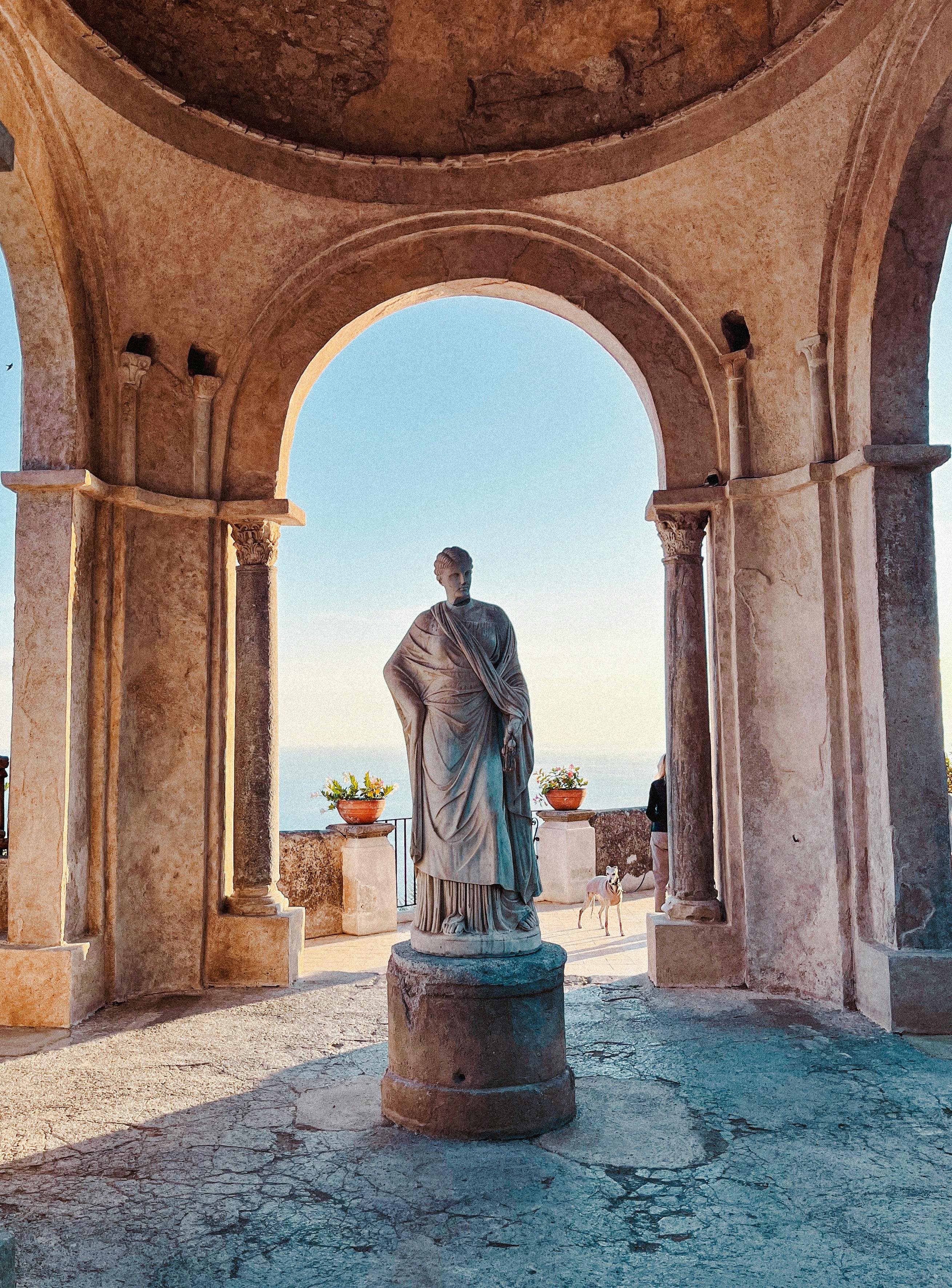 Discover this ancient Roman statue in a pavilion in Ravello, Italy, highlighted by afternoon sunlight.