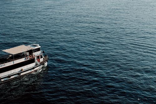 Free A tranquil scene of a boat cruising on the Bosphorus in Istanbul, Turkey. Stock Photo