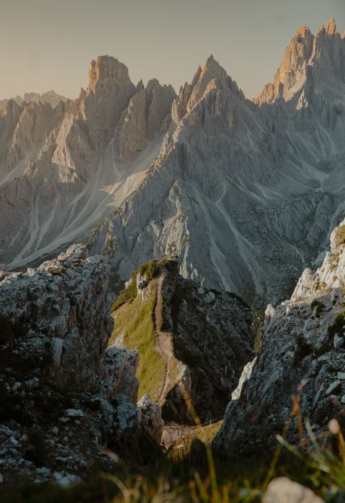 Free Stunning view of rocky mountain peaks at sunrise with detailed textures and shadows. Stock Photo