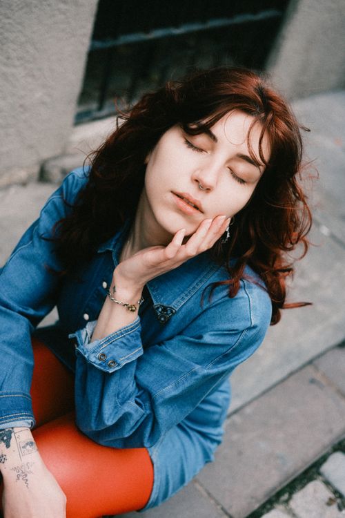 Woman Calm Look Relaxed Young Woman in Denim Outfit Outdoors · Free Stock Photo