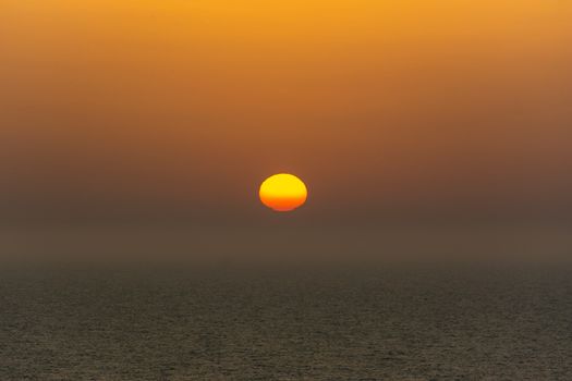 Captivating sunset with vibrant colors illuminating the ocean horizon.
