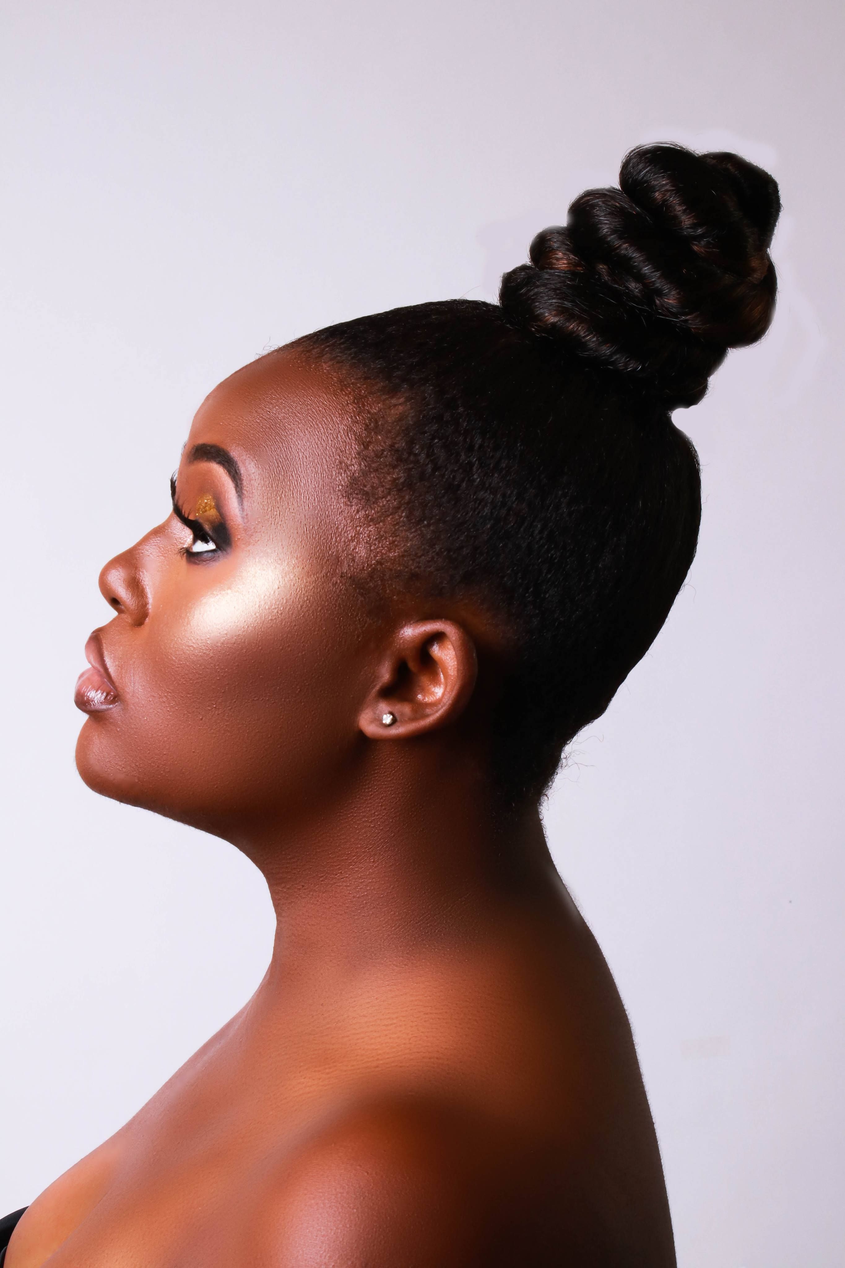 Side View Portrait Photo Of Woman Posing In Front Of White