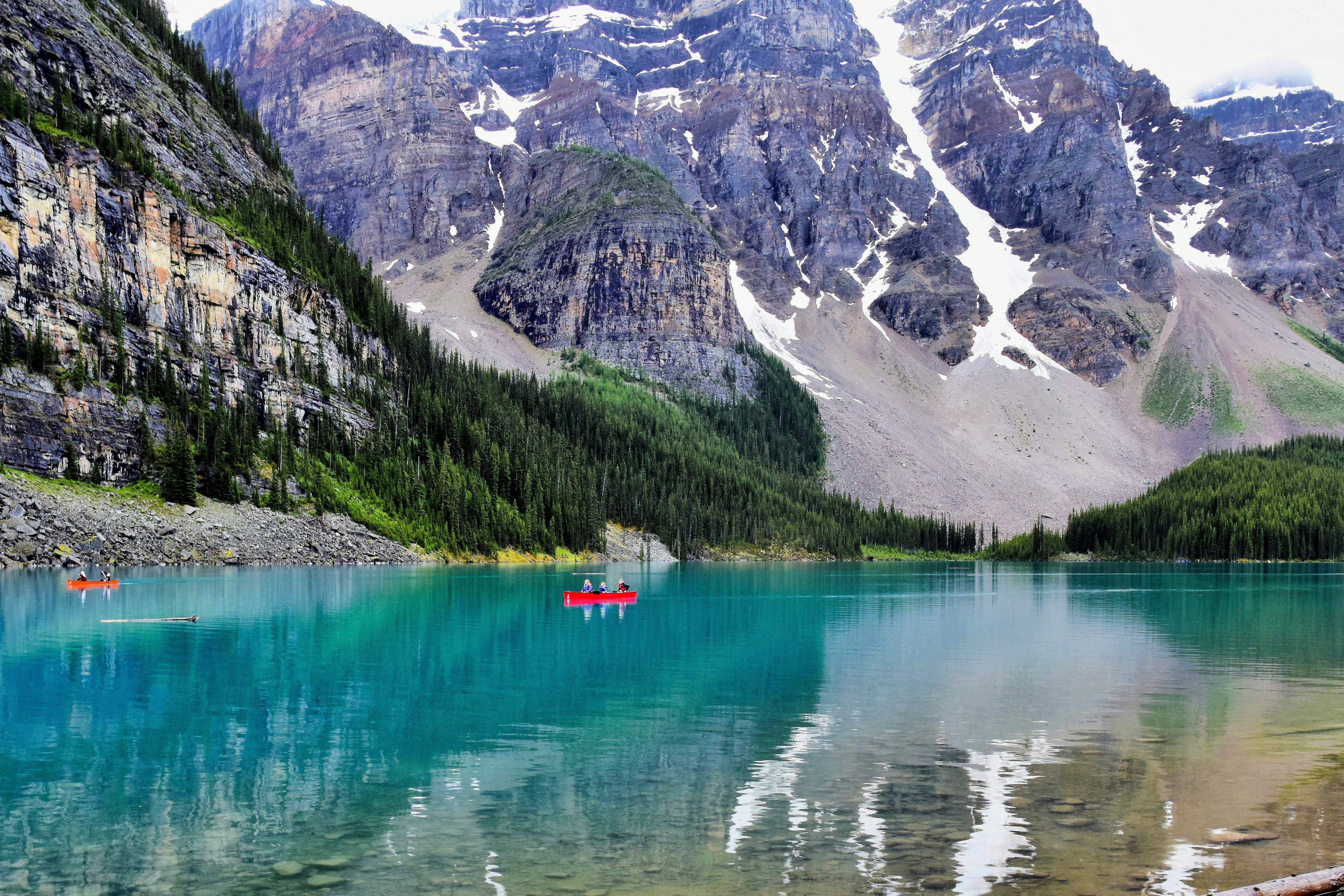 Stunning view of Moraine Lake in Banff National Park with turquoise waters and towering mountains.