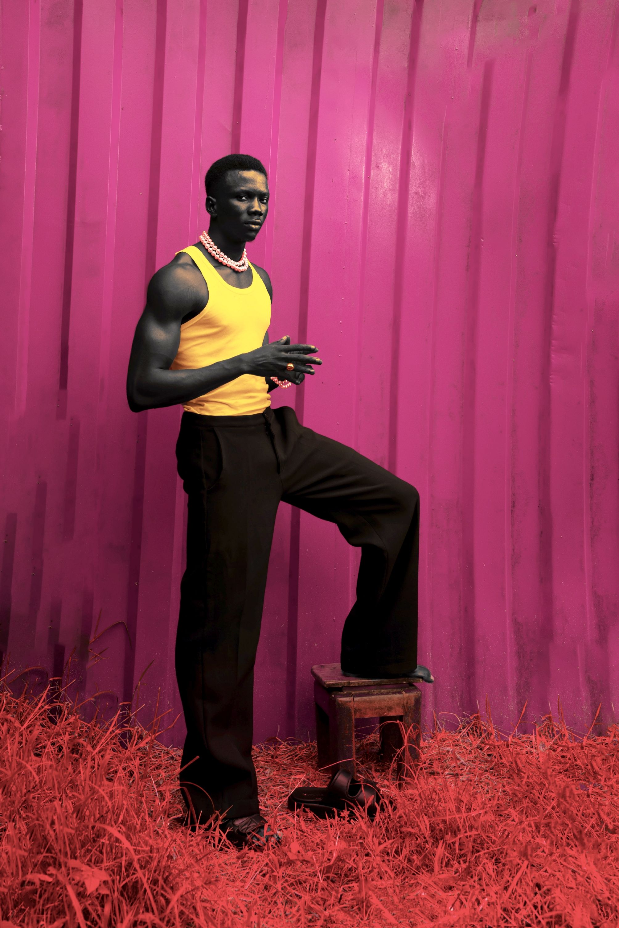 Elegant portrait of a man in bold colors, featuring striking contrast and modern fashion.