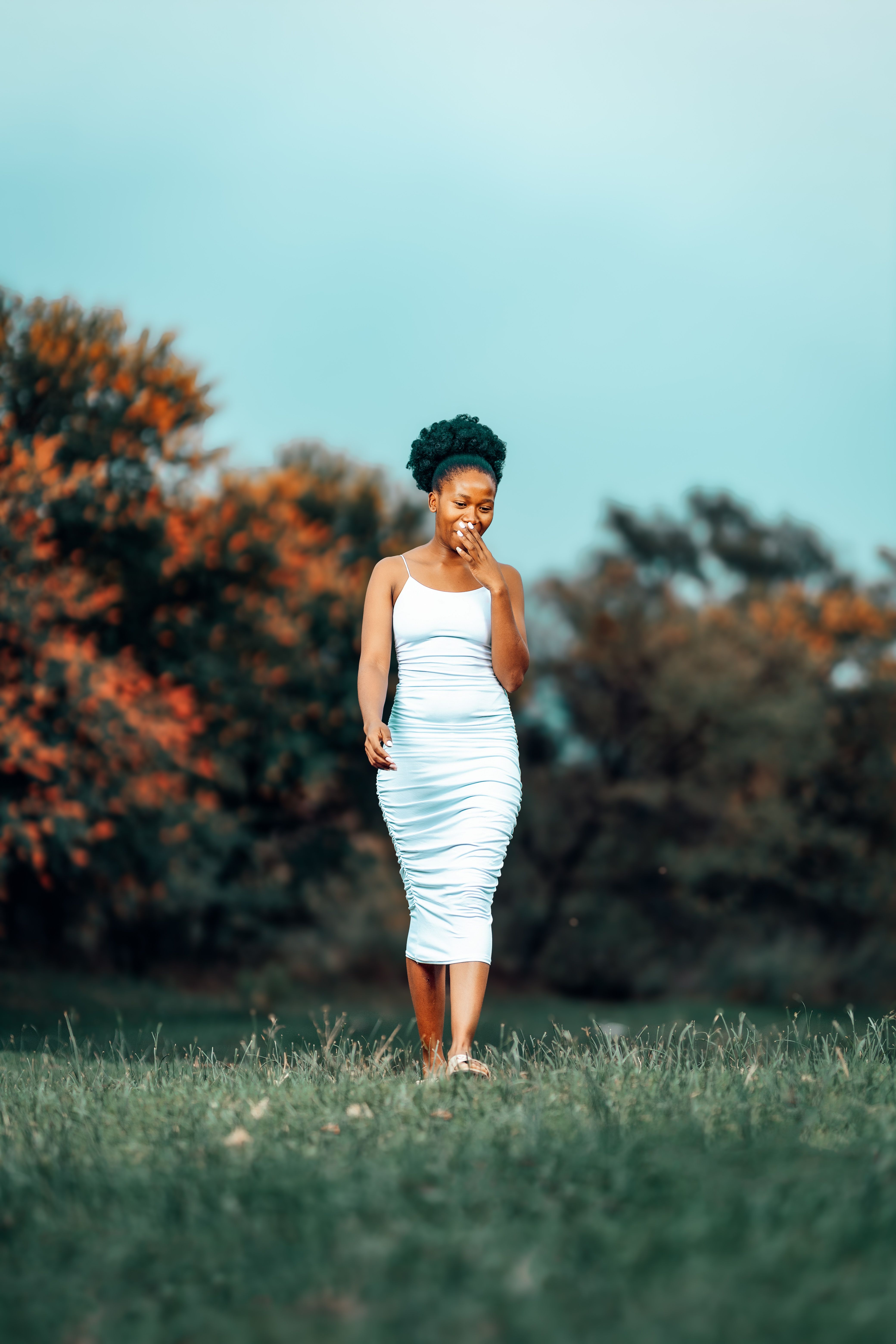 Elegant Woman Strolling Through Autumn Nature · Free Stock Photo