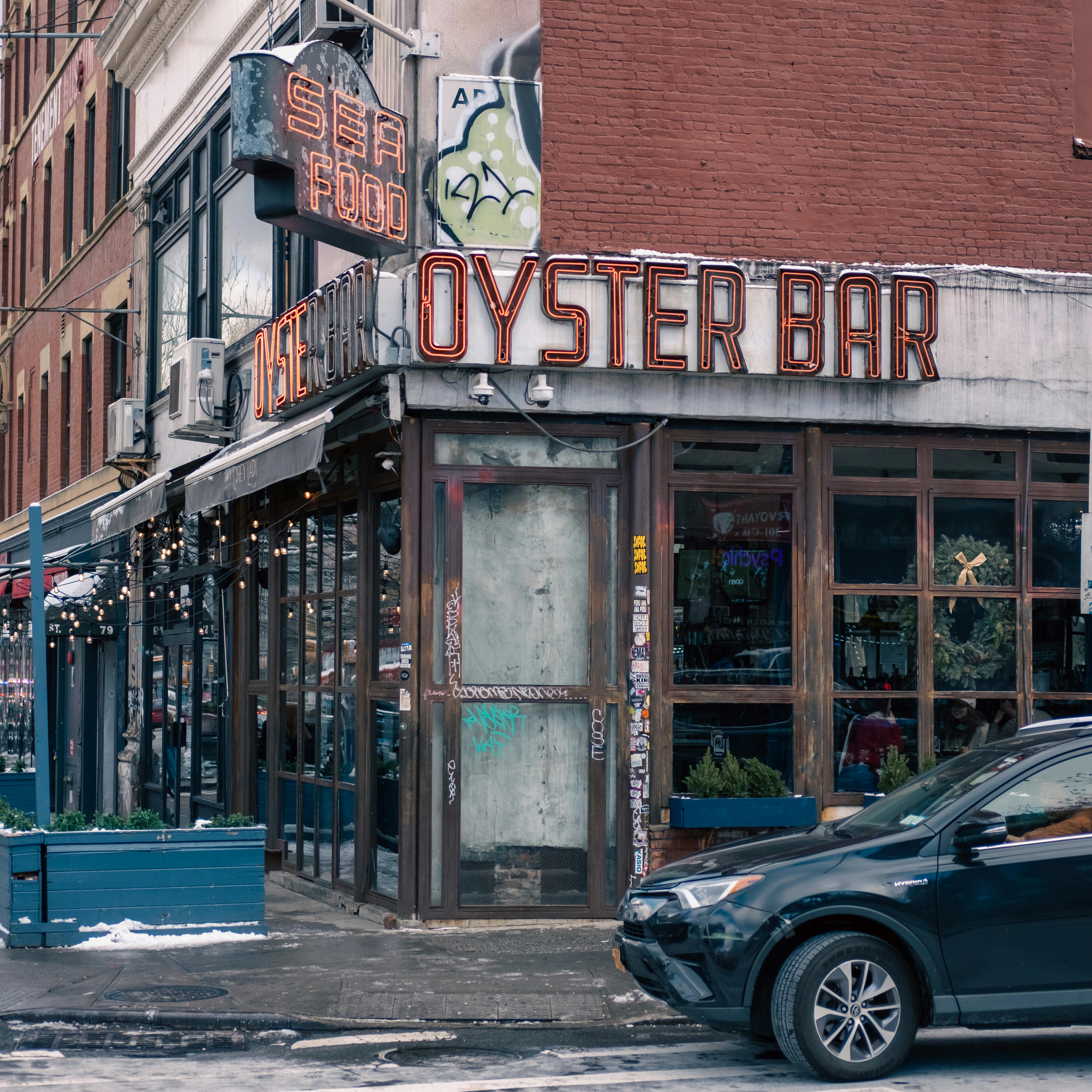 Free Charming vintage oyster bar storefront in New York City, showcasing urban architecture. Stock Photo