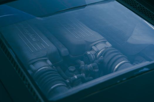 Detailed view of a Lamborghini engine under the transparent cover, captured in Benghazi, Libya.