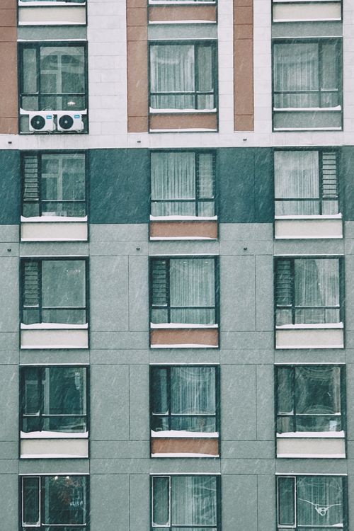 Free Snow-covered windows of a modern building facade in Astana, Kazakhstan. Stock Photo