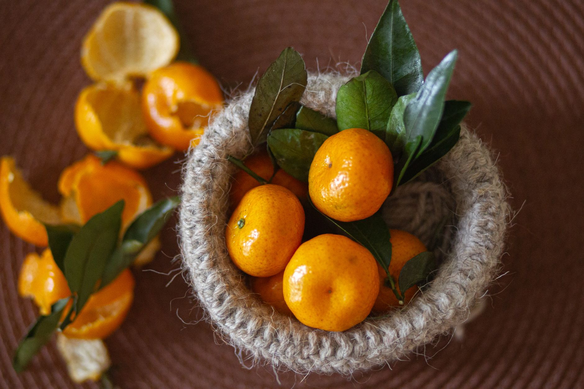 Rustic basket on kitchen shelf holding various pantry items