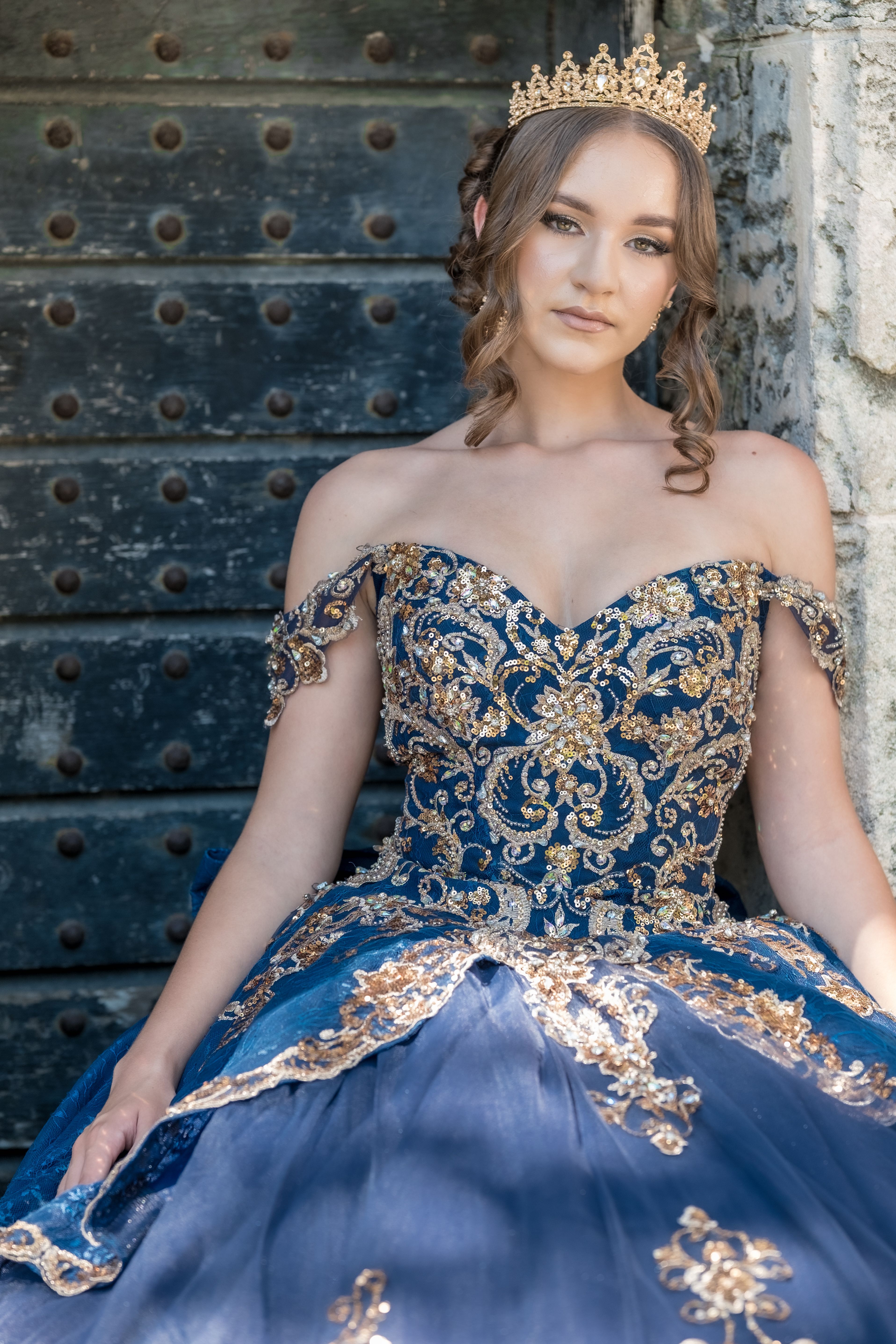 Elegant Woman in Blue and Gold Gown Outdoors · Free Stock Photo