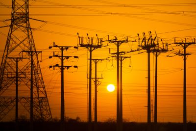 Sunset Silhouette of Power Lines and Towers · Free Stock Photo