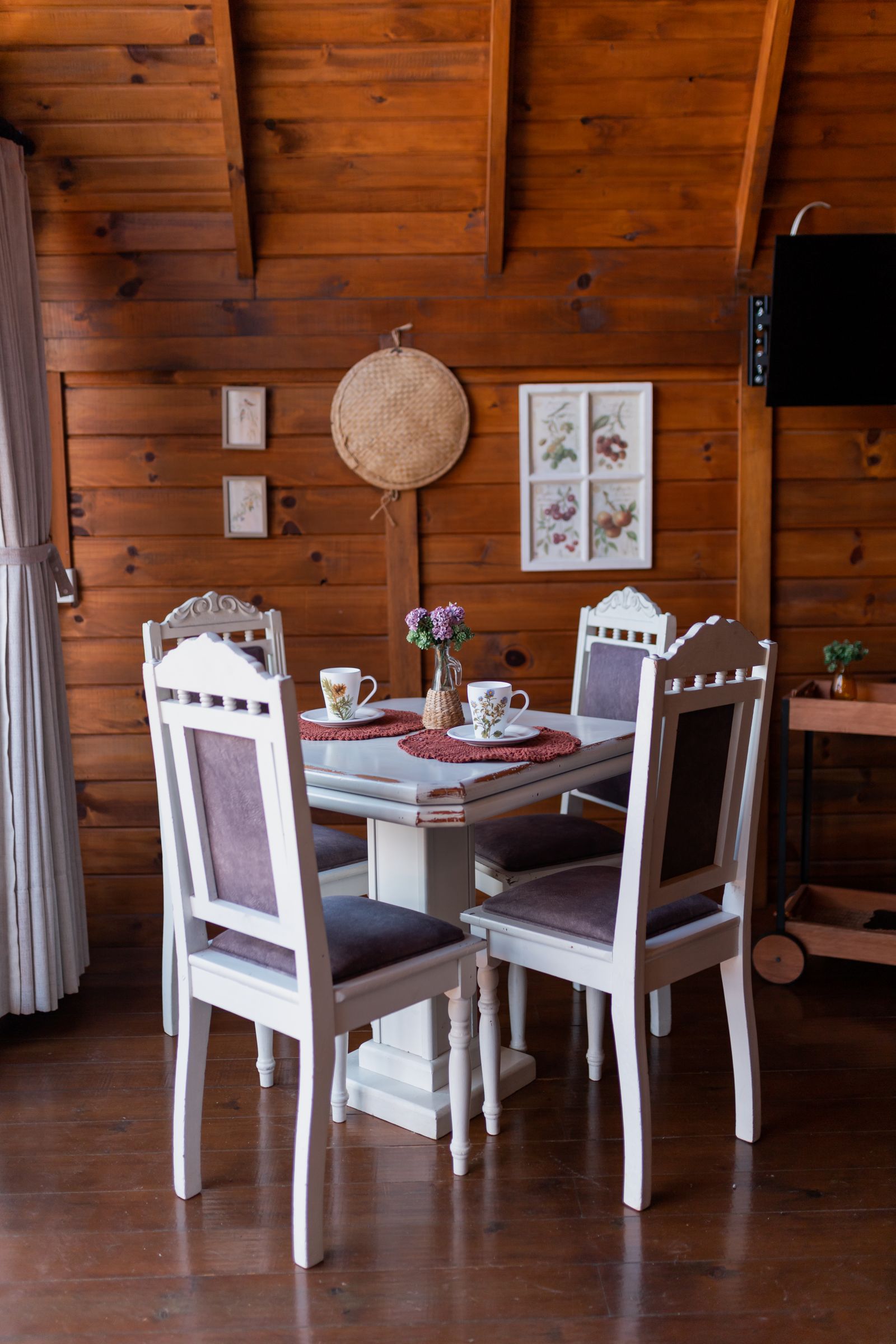 A rustic trattoria dining room with wooden walls and warm lighting