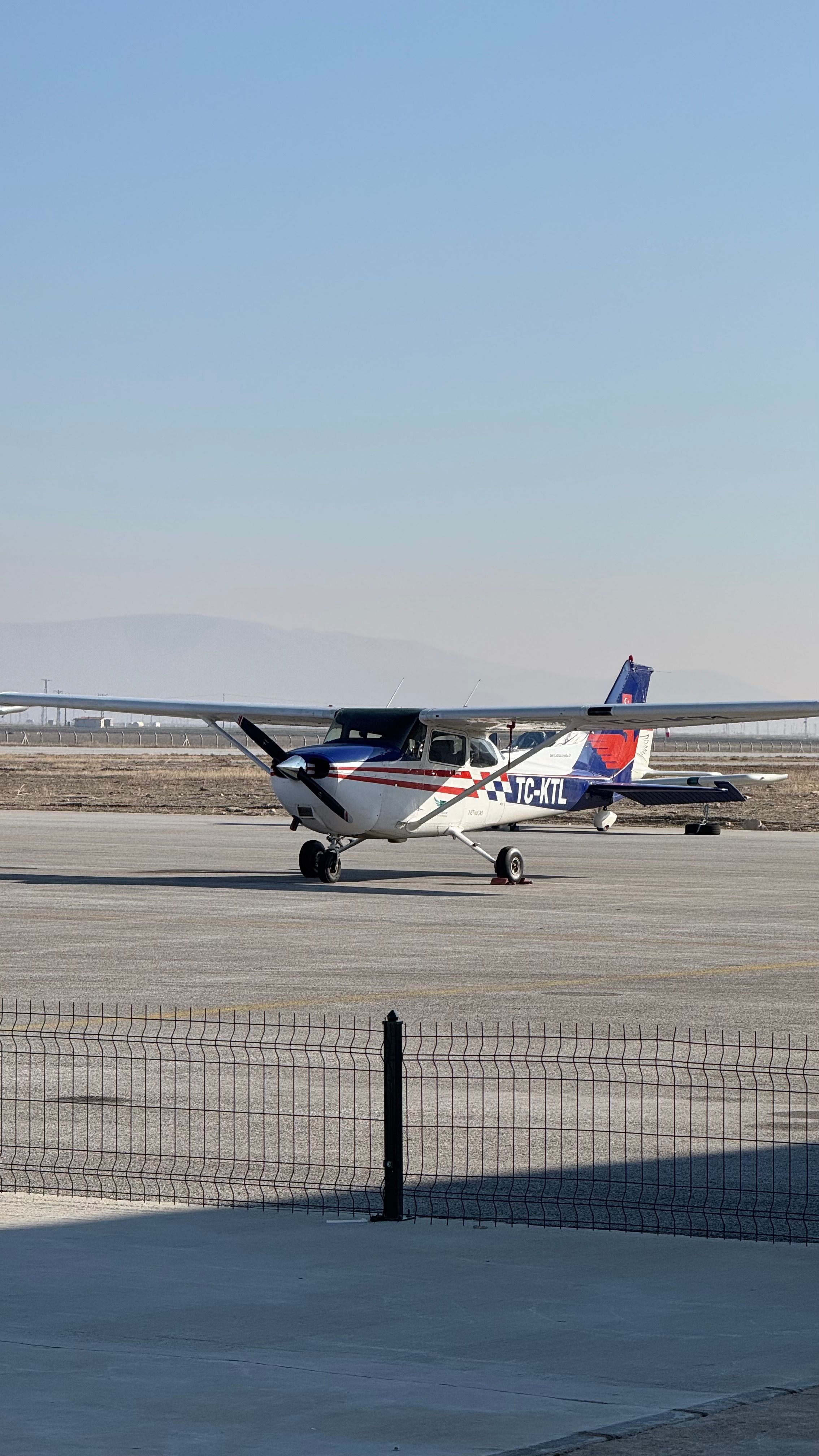 Small Cessna Aircraft on a Sunny Airfield · Free Stock Photo