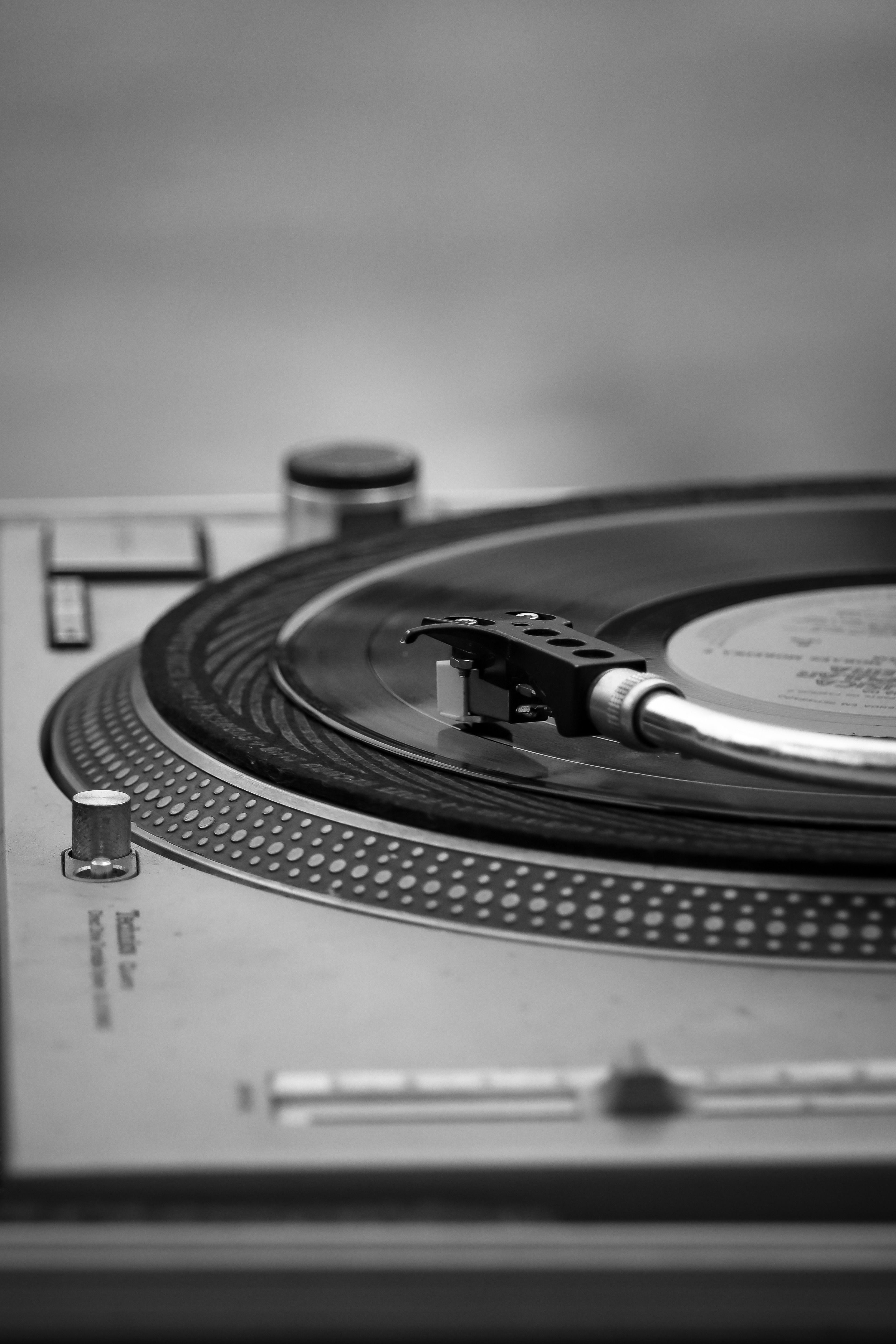 Close-up of a turntable stylus on a vinyl record
