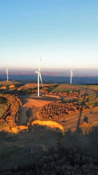 Aerial view of wind turbines on a sunny day in rural İstanbul, Türkiye.