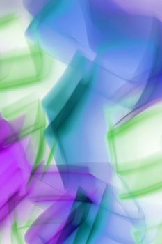 A vibrant abstract image featuring blurred colorful lights in motion.