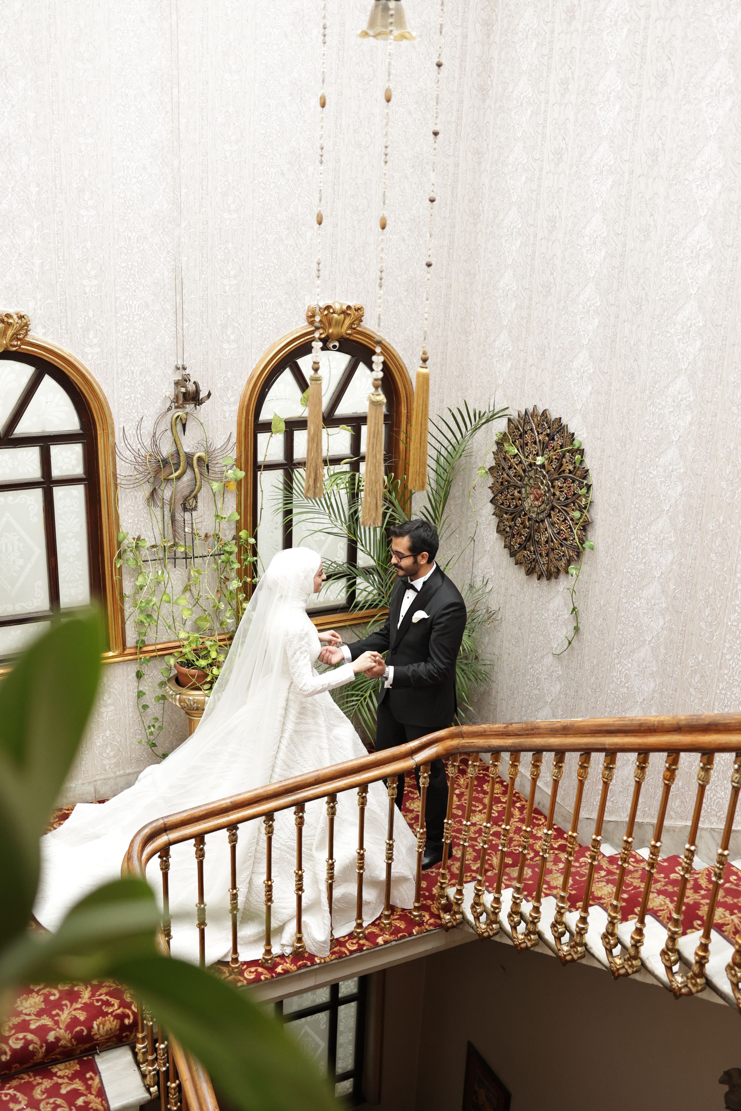 Elegant Wedding Couple on Grand Staircase · Free Stock Photo