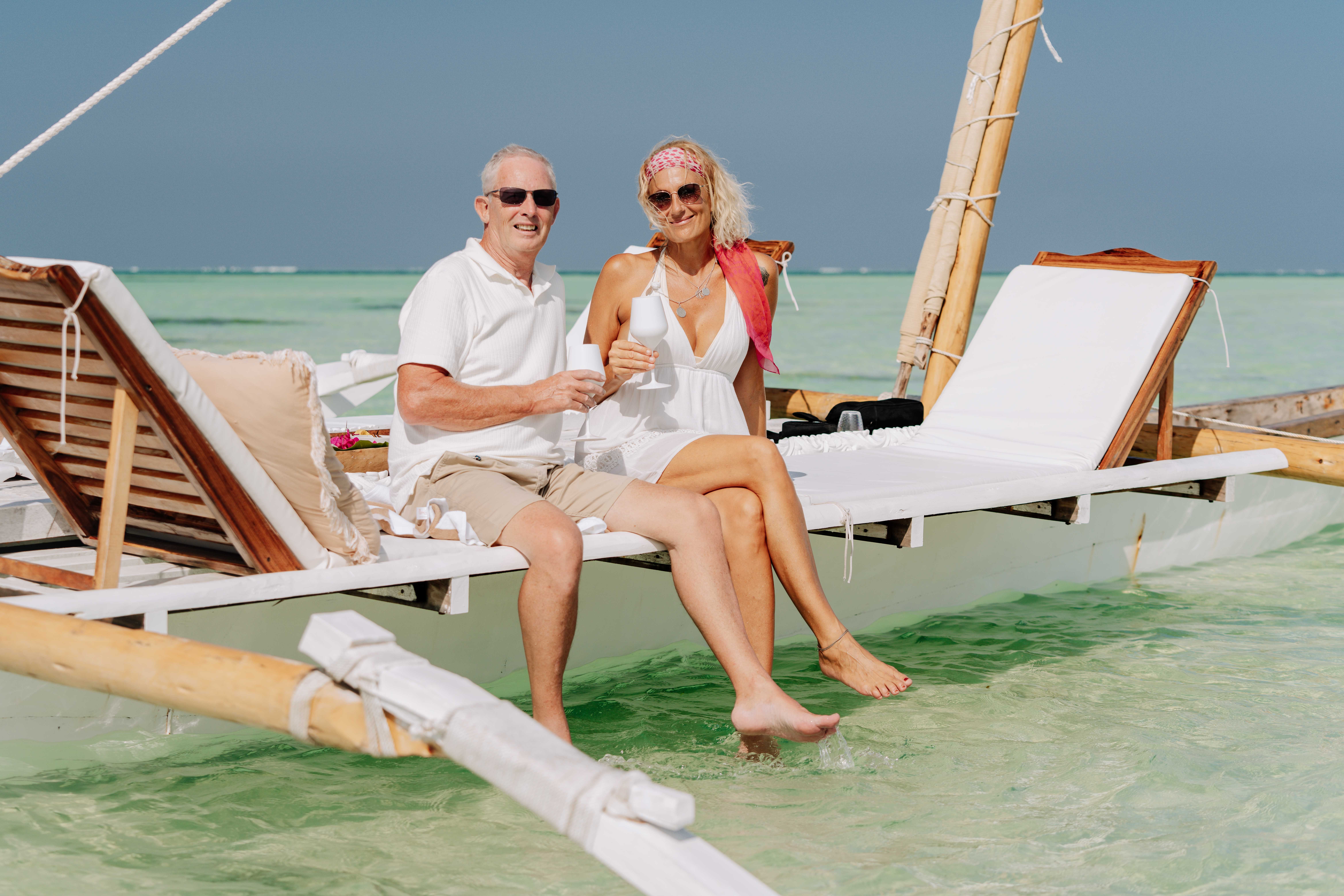 Elderly couple enjoying a summer day on a dhow in Zanzibar, Tanzania. Elderly couple enjoying a summer day on a dhow in Zanzibar, Tanzania.