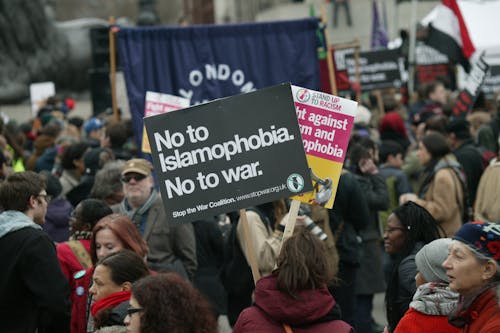 People Holding Banners