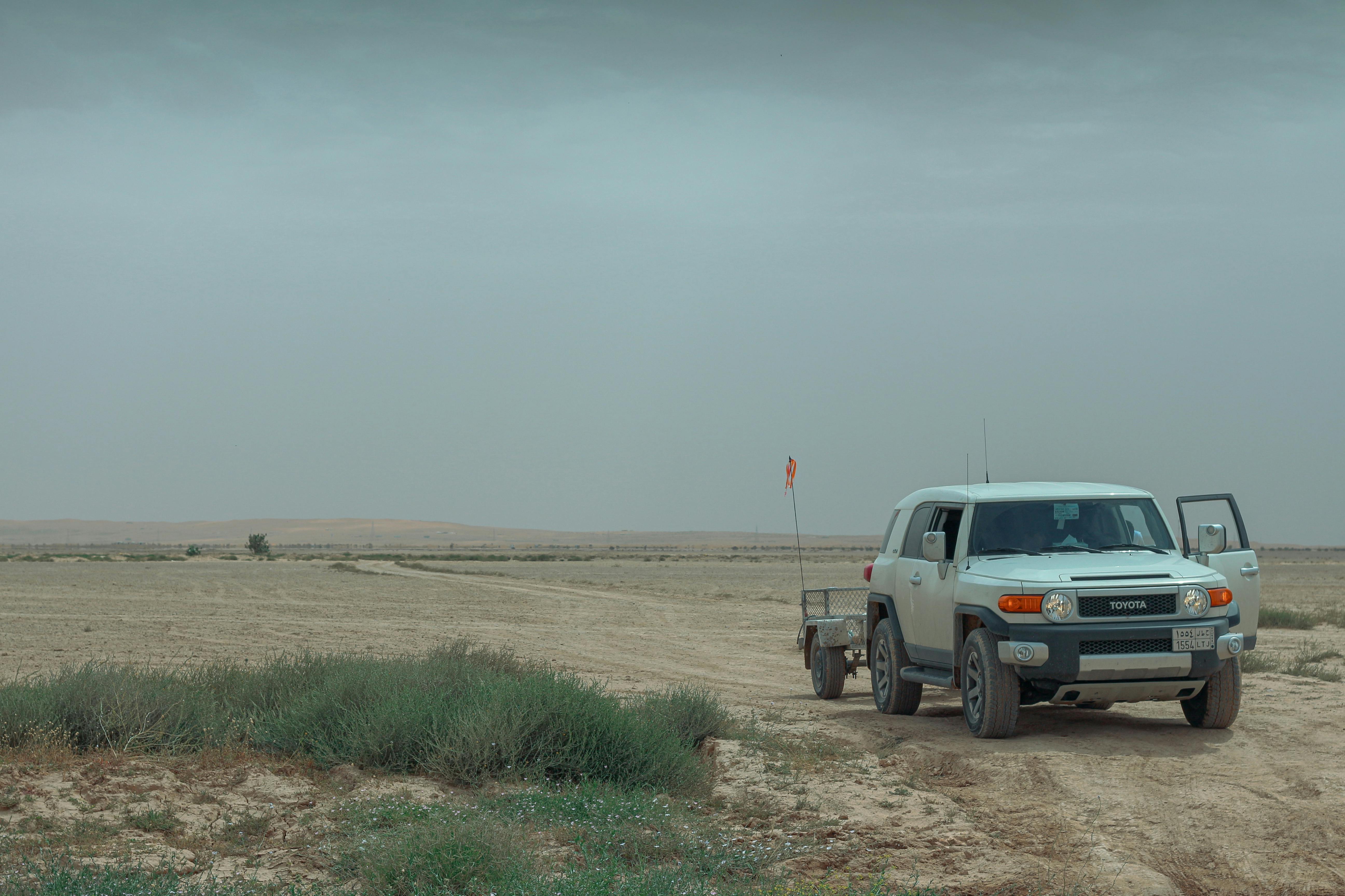 Navigating Permaculture Landscapes - Toyota FJ Cruiser off-road in the vast Riyadh desert, captur