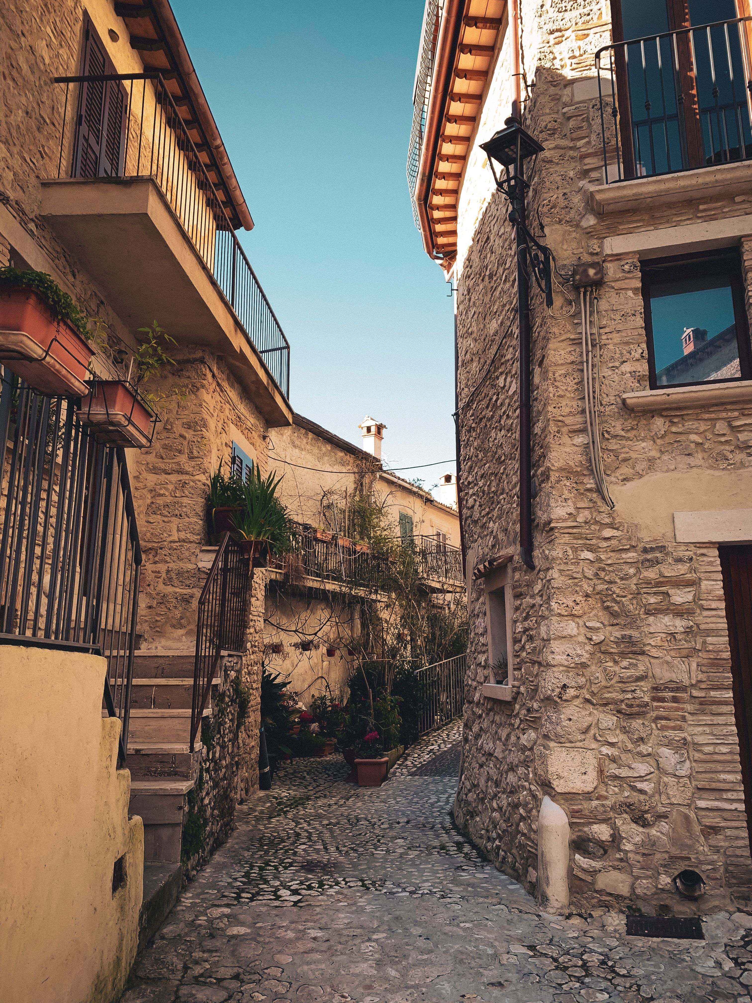 Discover the rustic charm and historic architecture of Castel di Tora's quaint alleyway.