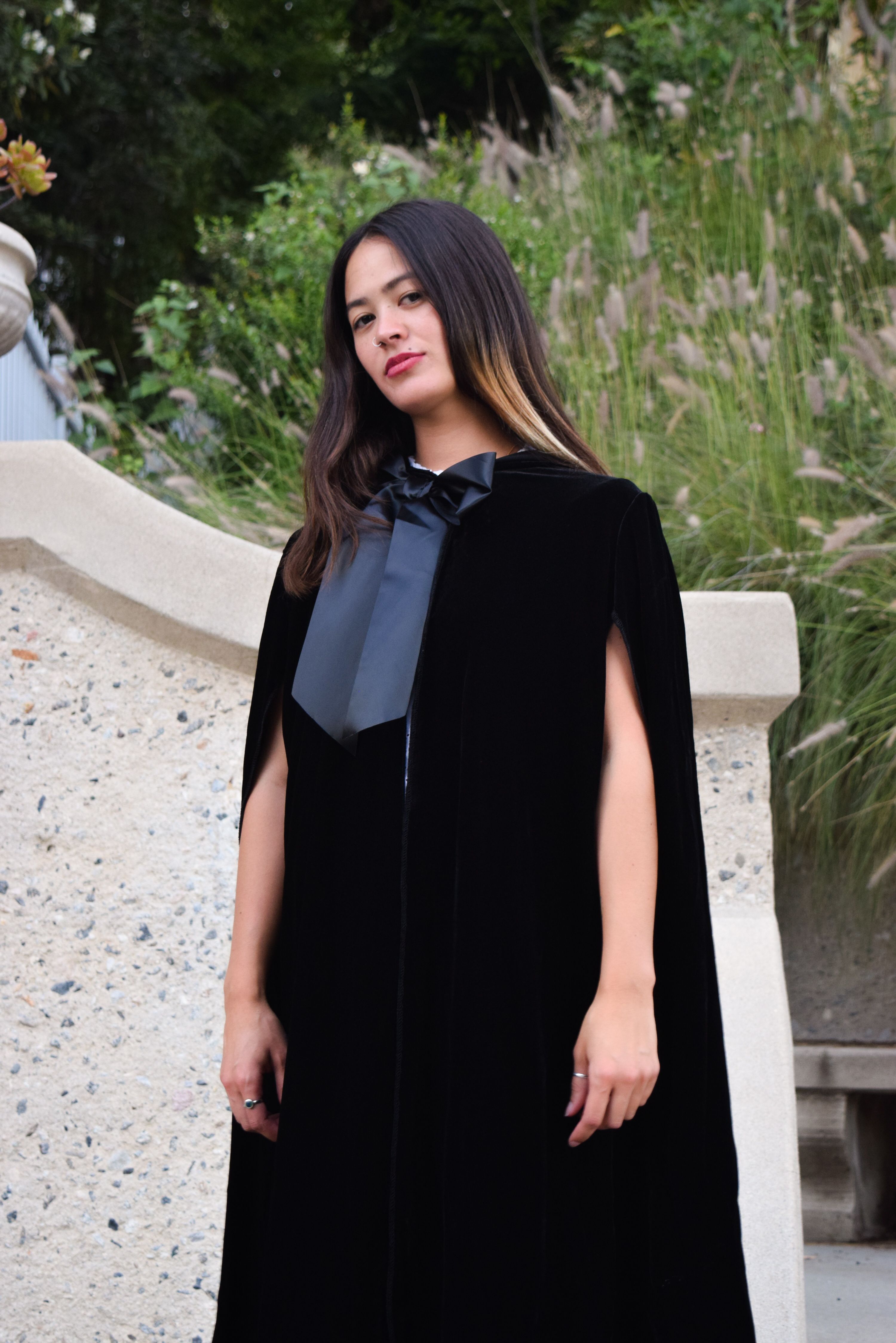 Elegant Woman in Black Velvet Cloak Outdoors · Free Stock Photo