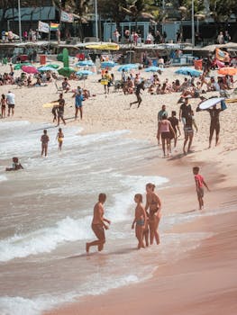 People enjoying a sunny day on Ipanema Beach, Rio de Janeiro's famous coastline.