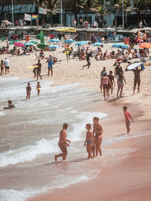 Free People enjoying a sunny day on Ipanema Beach, Rio de Janeiro's famous coastline. Stock Photo
