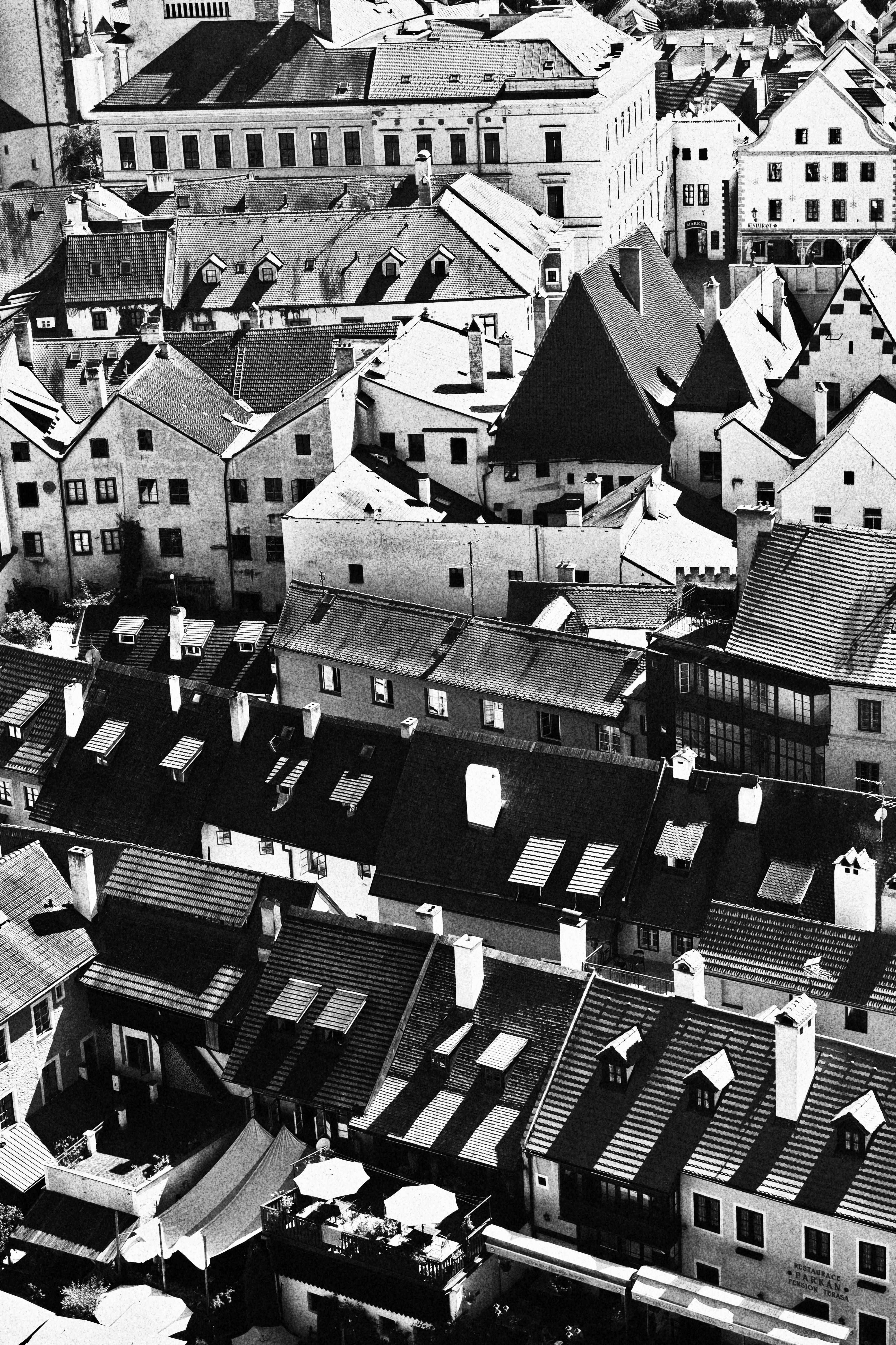 Black and white aerial view of Český Krumlov's historic rooftops