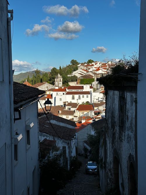 Free Explore the picturesque streets of Castelo de Vide in this captivating image with red-tiled roofs. Stock Photo