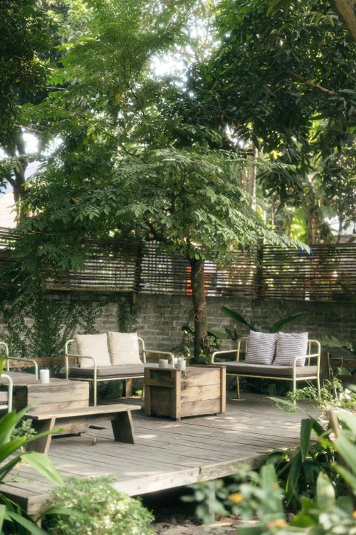 Free A tranquil outdoor patio setup in a lush garden in Lạng Sơn, Vietnam. Stock Photo