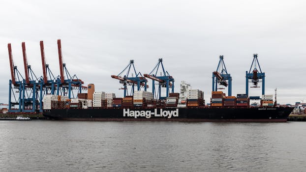 Large container ship Hapag-Lloyd at Hamburg port terminal, Germany.