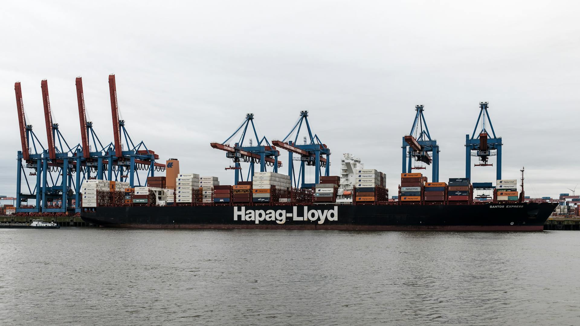 Large container ship Hapag-Lloyd at Hamburg port terminal, Germany.