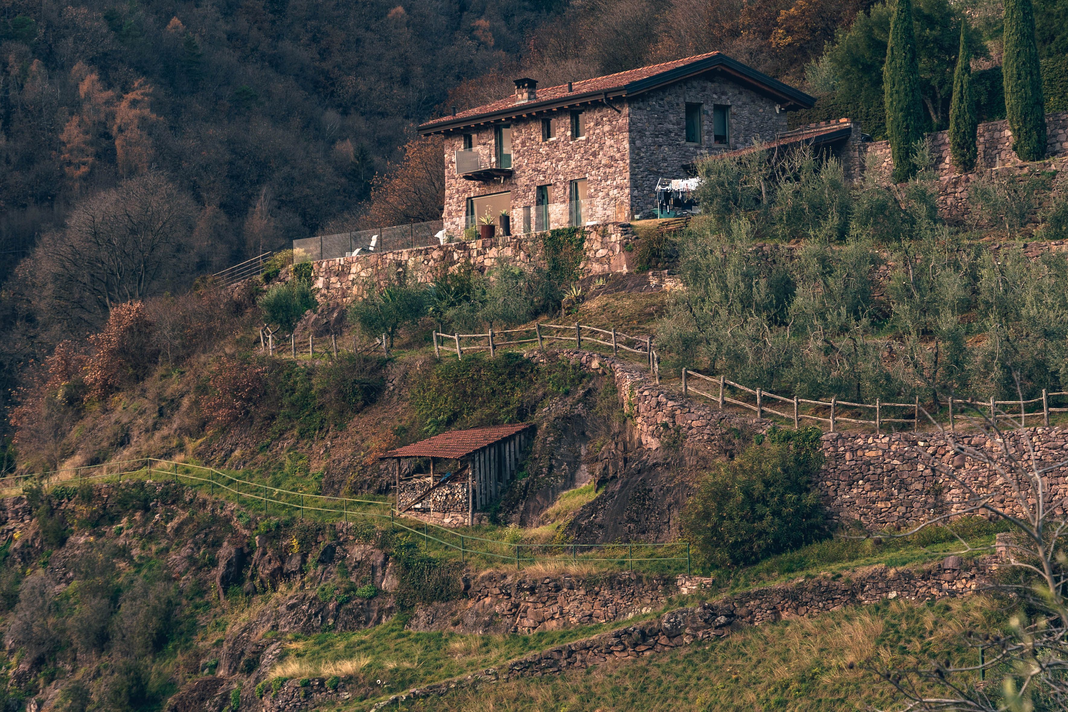 Rustic Stone House on Scenic Hill in Autumn · Free Stock Photo
