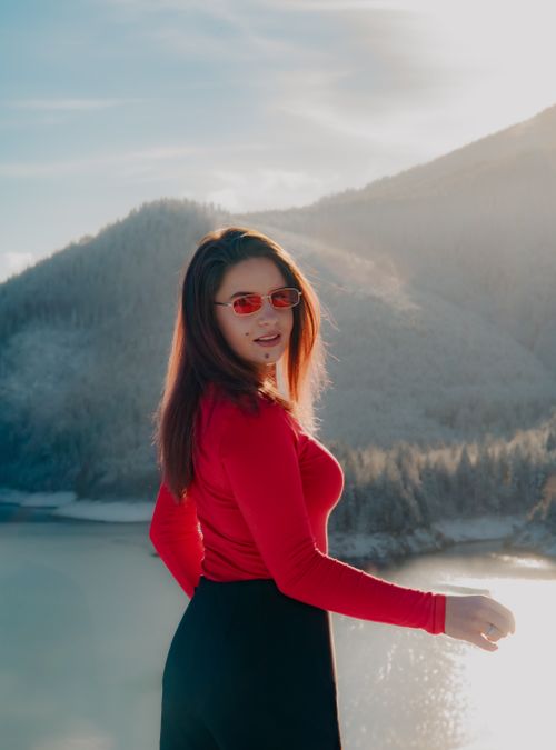 Free Woman wearing red in Cluj-Napoca's snowy landscape. Stock Photo