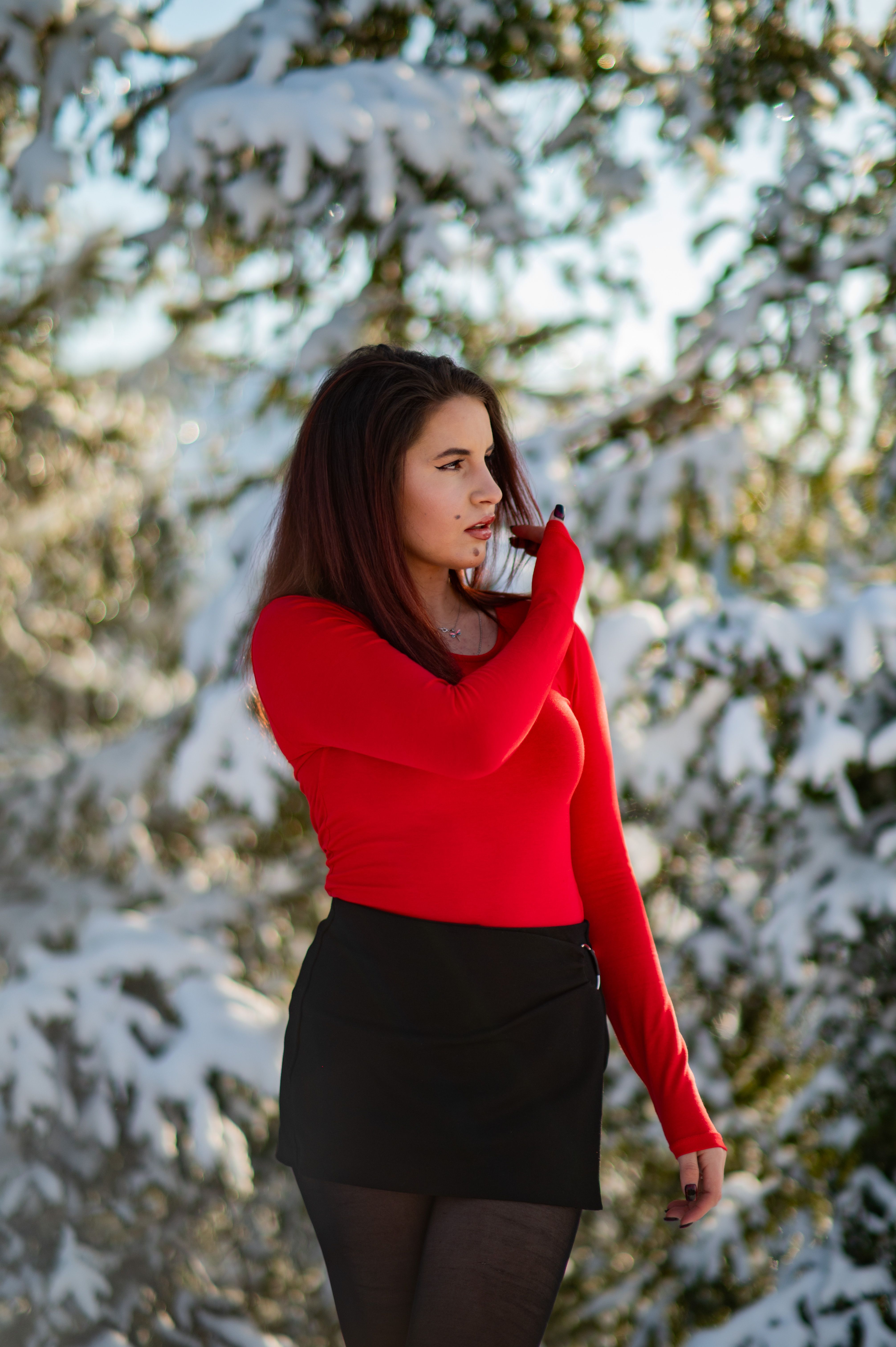 Woman in Red Top Surrounded by Snowy Trees · Free Stock Photo